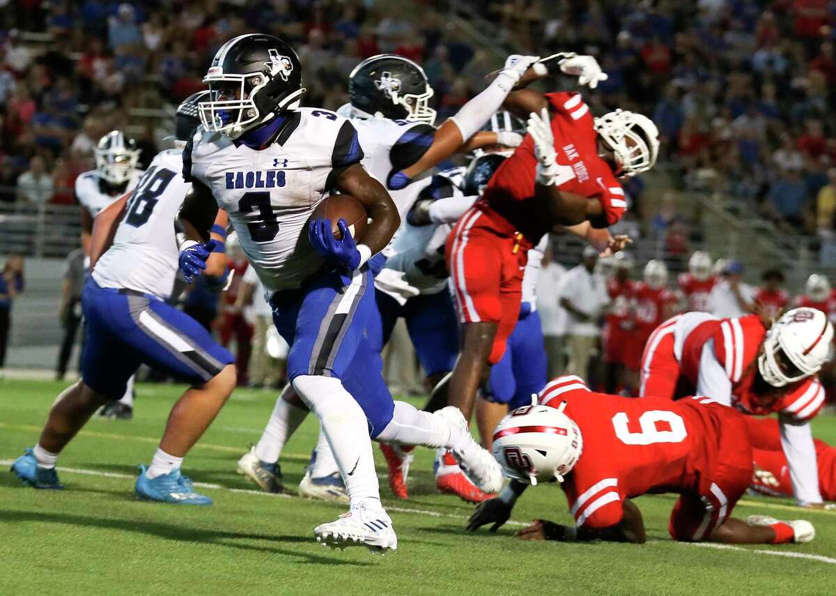 New Caney running back Kedrick Reescano (3) runs for a 6-yard touchdown to tie the game 21-21 in the second quarter of a District 13-6A high school football game at Woodforest Bank Stadium, Thursday, Sept. 22, 2022, in Shenandoah.
