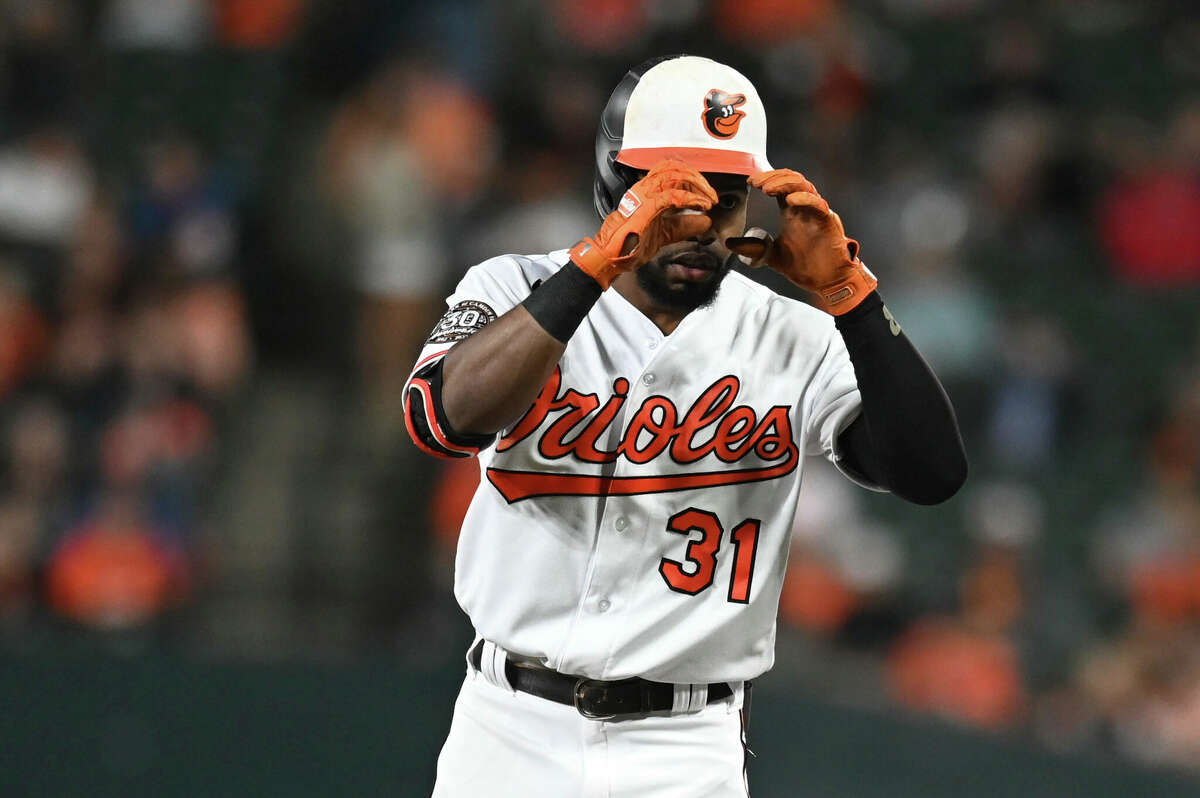 Baltimore Orioles' Cedric Mullins (31) reacts after hitting a single during the first inning of a baseball game against the Houston Astros , Tuesday, Sept. 22, 2022, in Baltimore. (AP Photo/Tommy Gilligan)