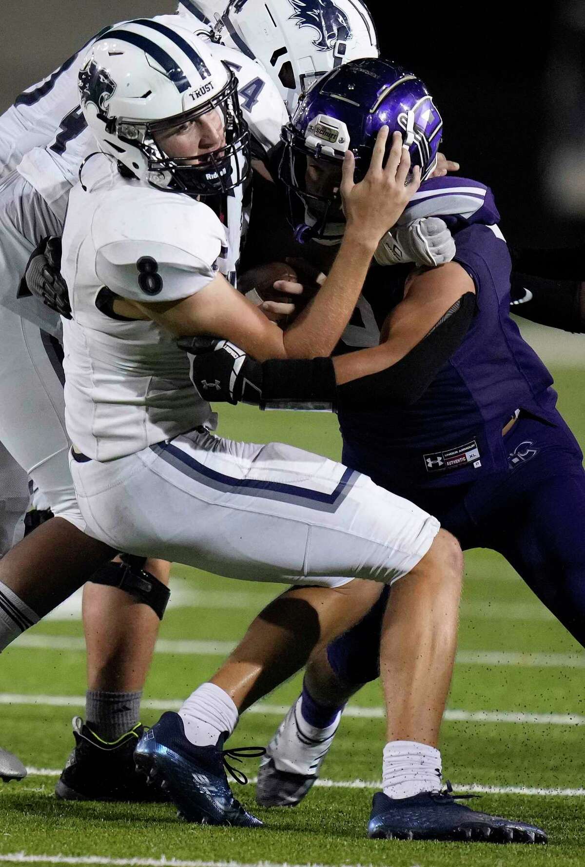 Tomball Memorial quarterback Reed Odell (8) is sacked by Klein Cain defensive lineman Jacob Hollins during the second half of a high school football game, Thursday, Sept. 22, 2022, in Klein.