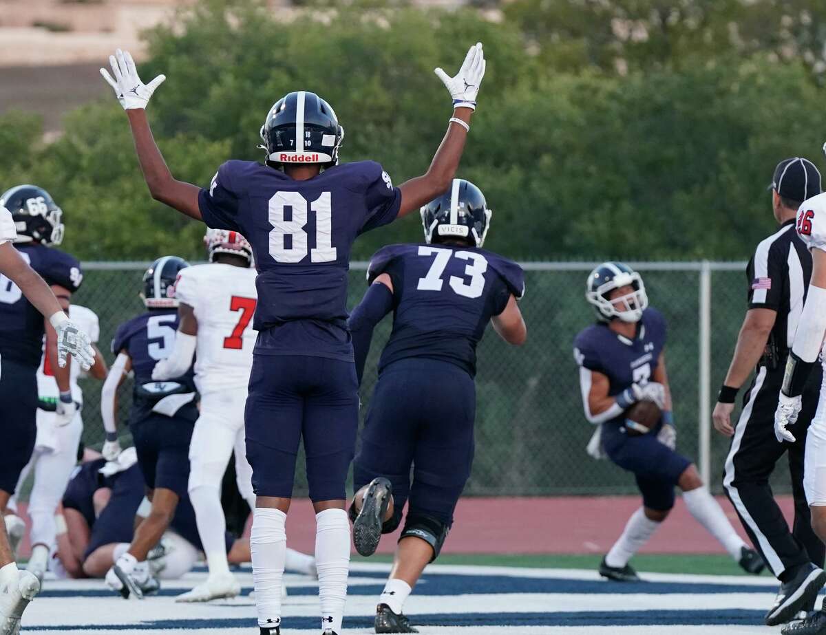 Smithson Valley's TJ Hunt signals David Dehoyos' touchdown during Thursday nights battle between #1 New Braunfels Canyon and #2 Smithson Valley at Ranger Stadium.