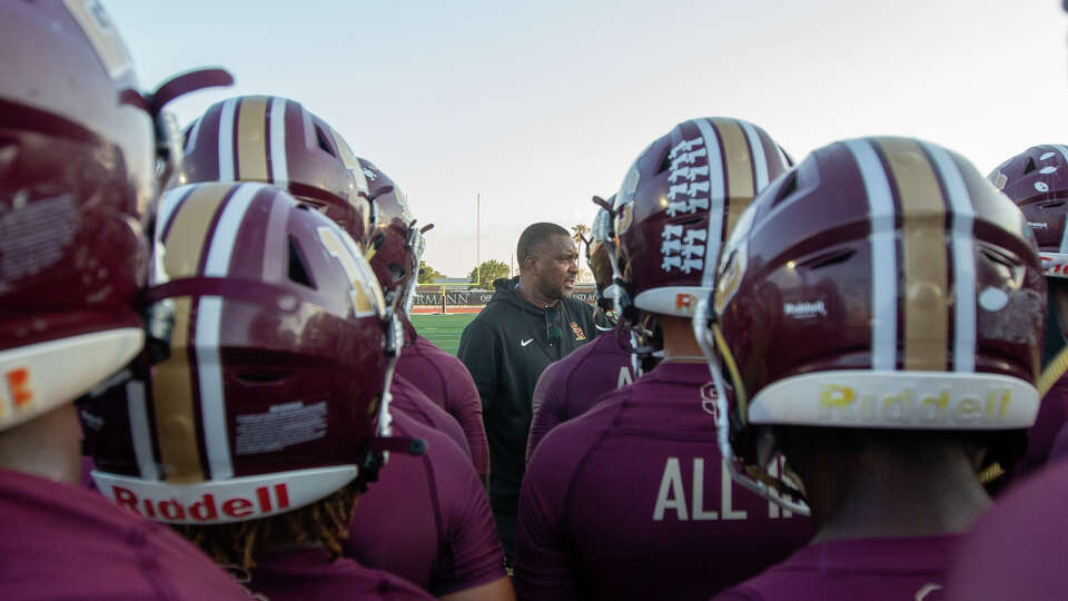 Summer Creek head coach Kenny Harrison speaking to his players prior to the start of a high school football game between Summer Creek vs. Beaumont West Brook at Turner Stadium, Thursday, September 22, 2022, in Humble. Summer Creek Bulldogs defeated West Brook Bruins 69-0.