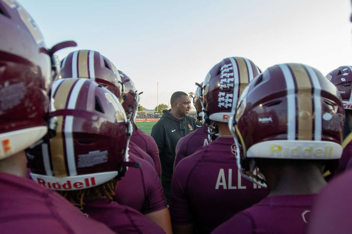 Summer Creek head coach Kenny Harrison speaking to his players prior to the start of a high school football game between Summer Creek vs. Beaumont West Brook at Turner Stadium, Thursday, September 22, 2022, in Humble. Summer Creek Bulldogs defeated West Brook Bruins 69-0.