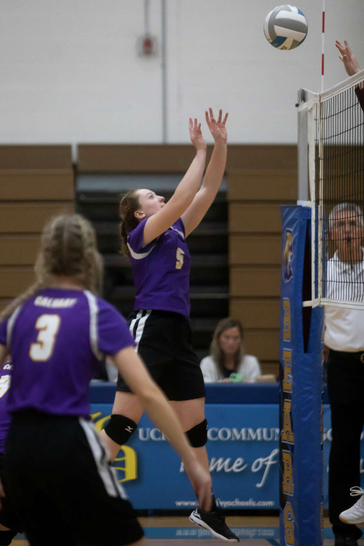 Calvary Baptist's Caitlyn Dickerson pushes the ball during a Nov. 11, 2021 regional final against Traverse City Christian. Dickerson had eight kills Thursday to lead the Kings to a sweep over Merrill.