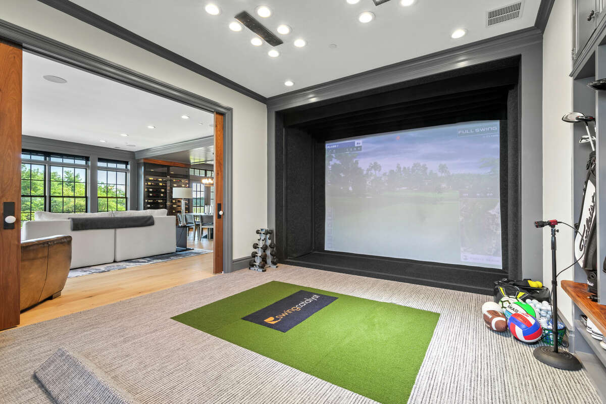 Unit 17 at The Residences at 66 High Street in Guilford, Conn. won two Home Builder Industry (HOBI) Awards and features a golf simulator room.