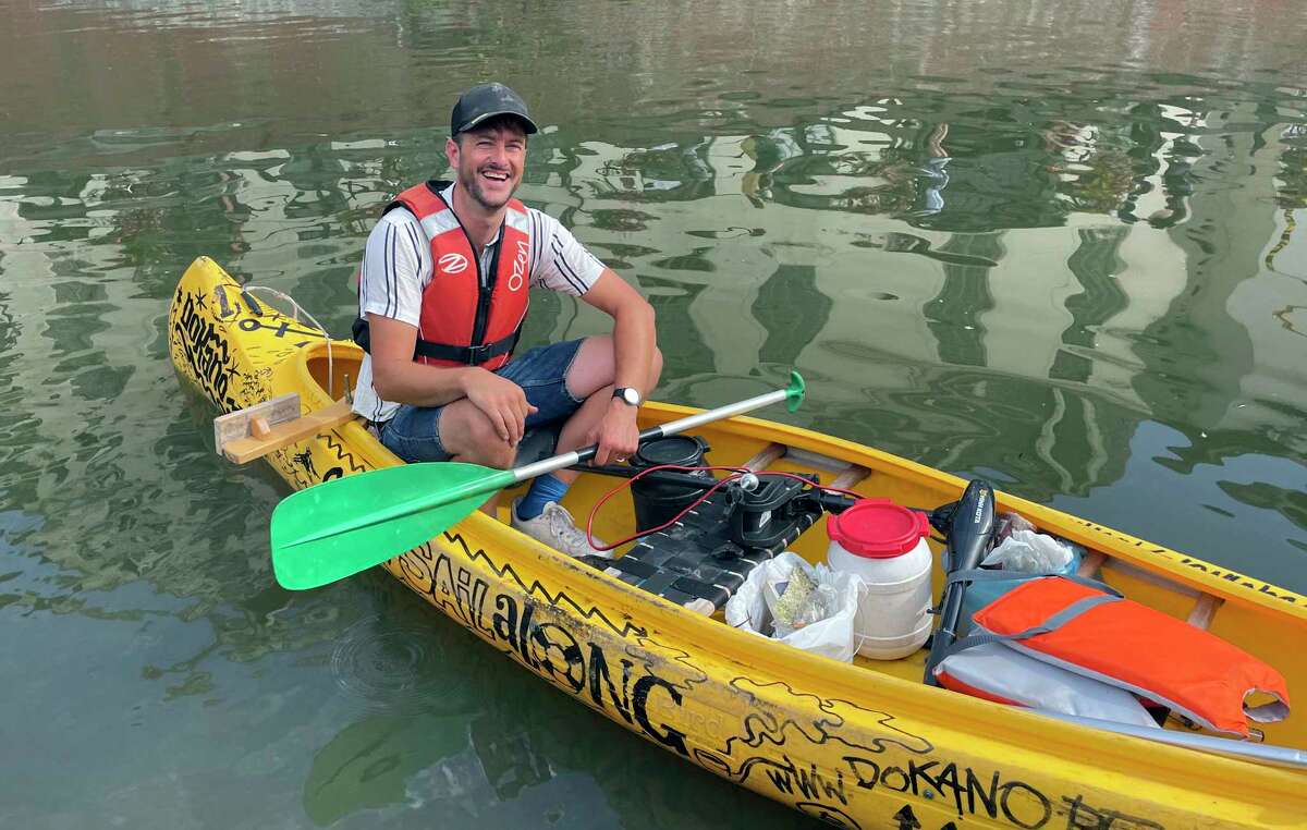 Hans Marly of DOKano takes a break from paddling. The organization encourages people to explore Ghent's waterways and clean up trash.