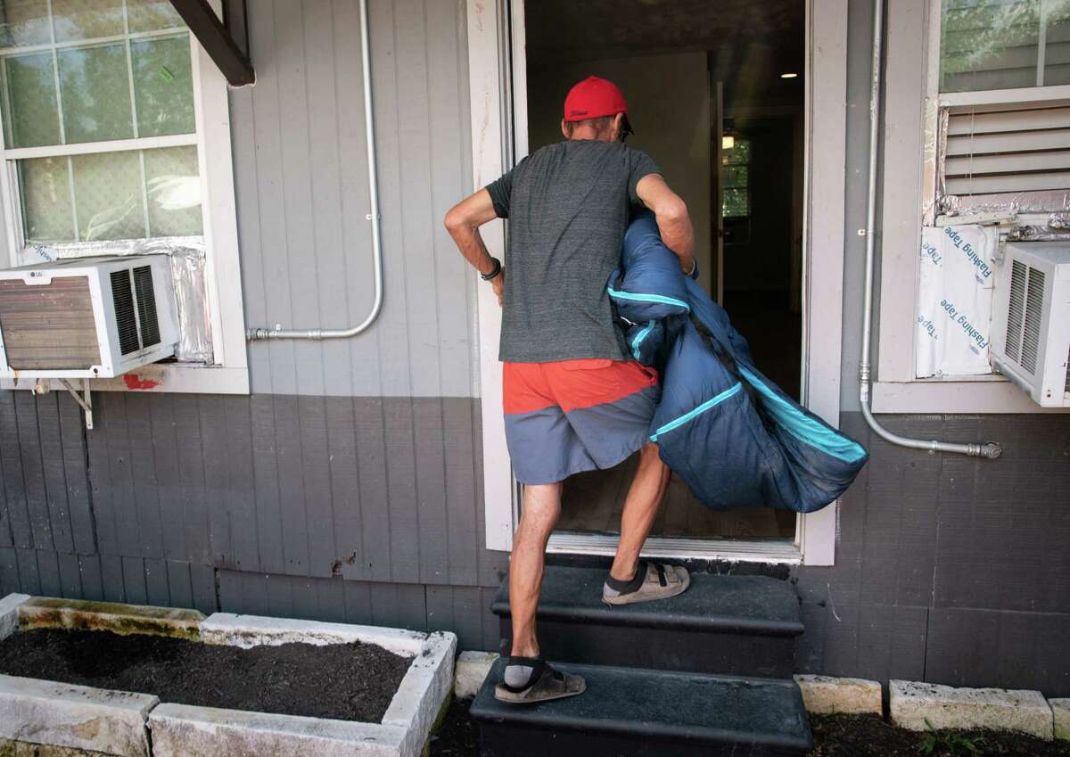 Houston friends move from encampment to quiet apartments