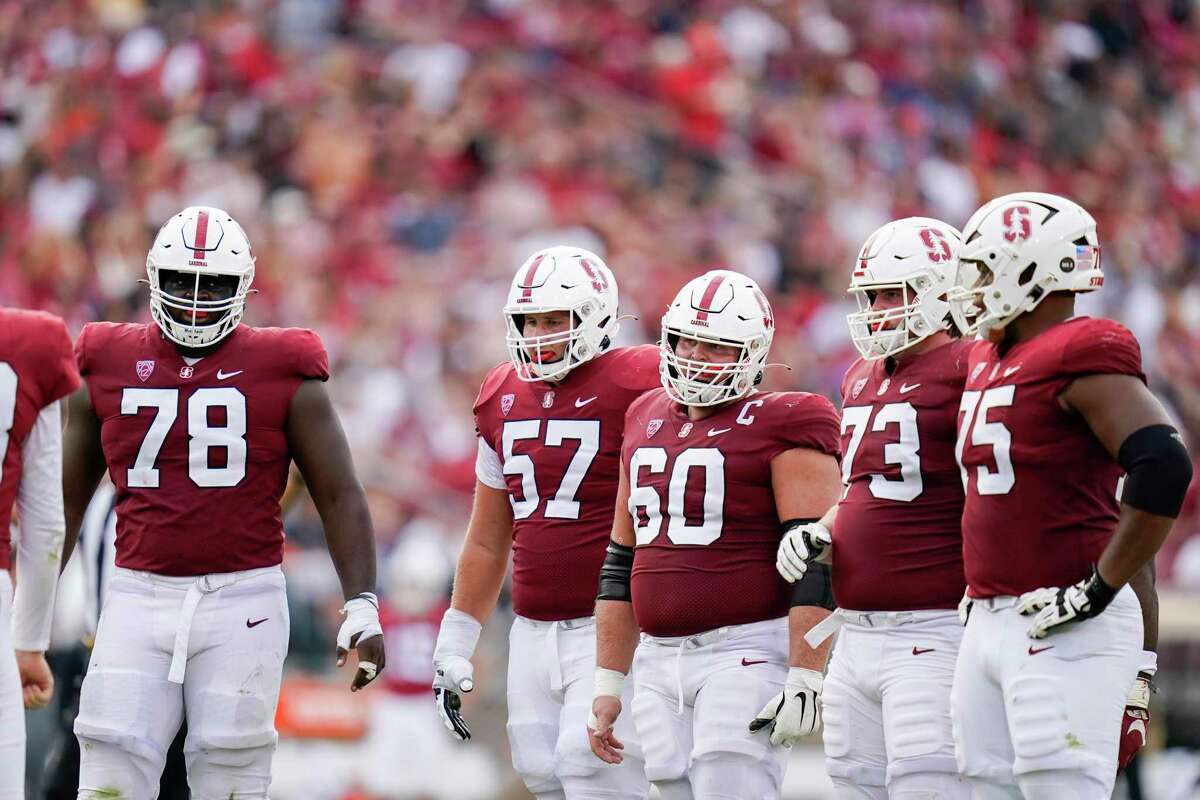 Stanford offensive linemen Myles Hinton (78), Levi Rogers (57), Drake Nugent (60), Jake Hornibrook (73) and Walter Rouse (75) wait for the offense to huddle during the first half of an NCAA college football game against Southern California in Stanford, Calif., Saturday, Sept. 10, 2022. (AP Photo/Godofredo A. Vásquez)