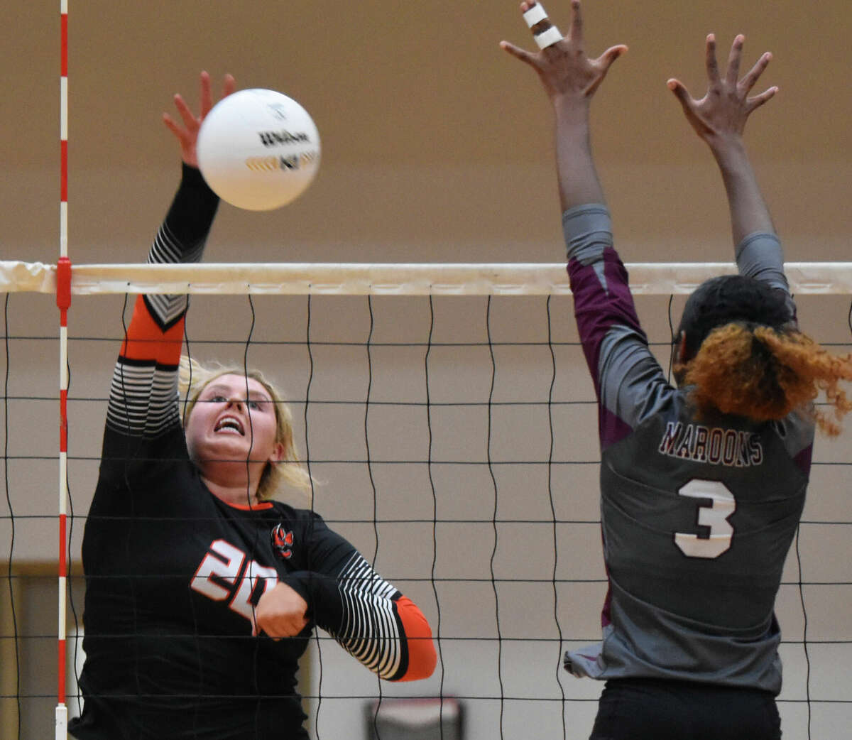 Edwardsville's Claire Dunivan with a kill against Belleville West on Thursday inside Lucco-Jackson Gymnasium.