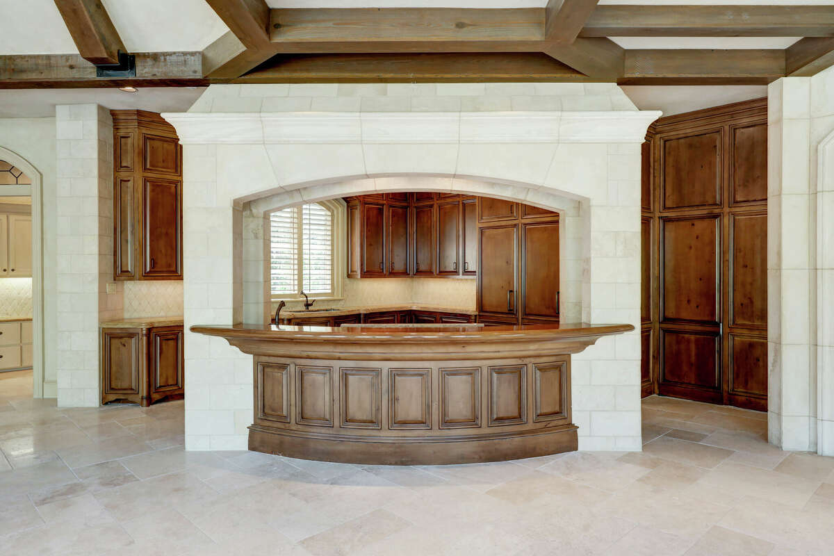 The kitchen island opens to the informal dining room and den.