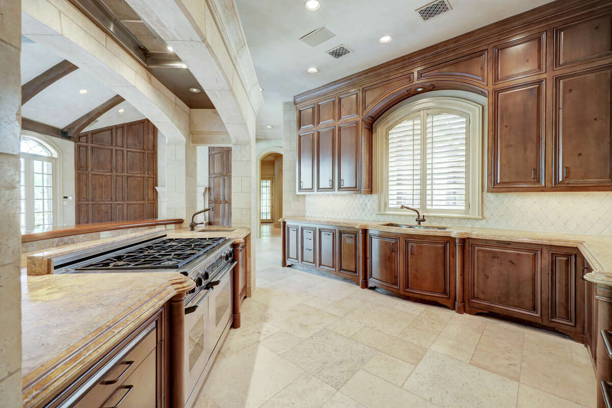 The kitchen has custom knotty alder cabinetry.