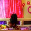 Nevaeh Hall, 10, in her room at her home on Friday, Sept. 23, 2022 in Houston. A jury says dental malpractice caused $95 million in harm to her and her family when the then 4-year-old Nevaeh suffered brain damage during a dentist visit in 2016. She now requires round-the-clock care from her family. The dentist lost her license, and is scheduled to begin a criminal trial in the near future.
