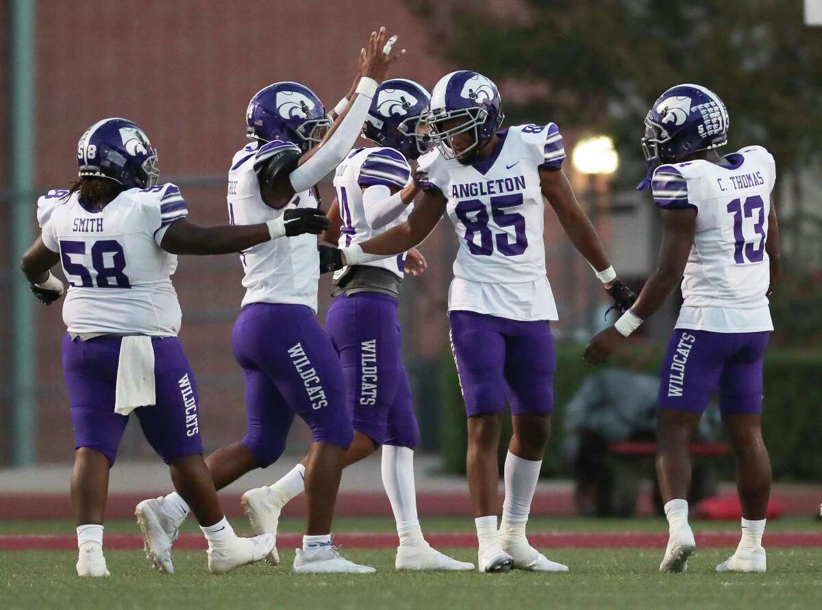 Angleton wide receiver Langston Myrick (85) celebrates with teammates after his 34-yard touchdown during the first quarter of a District 10-5A (Div. I) high school football game at Bulldog Stadium, Friday, Sept. 23, 2022, in Magnolia.