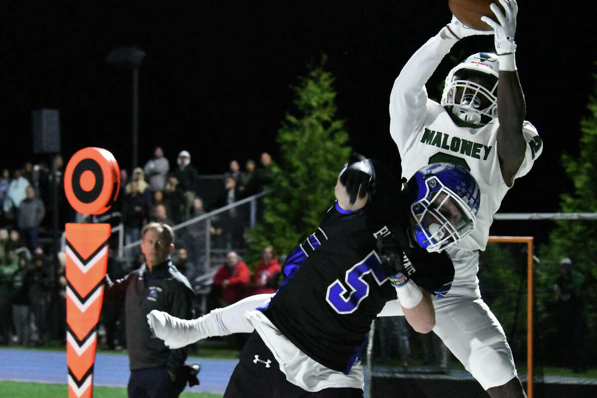 Maloney's Donte Kelly grabs a pass for a touchdown during a football game between Maloney and Darien at Darien High School, Darien on Friday, Sept. 23, 2022.