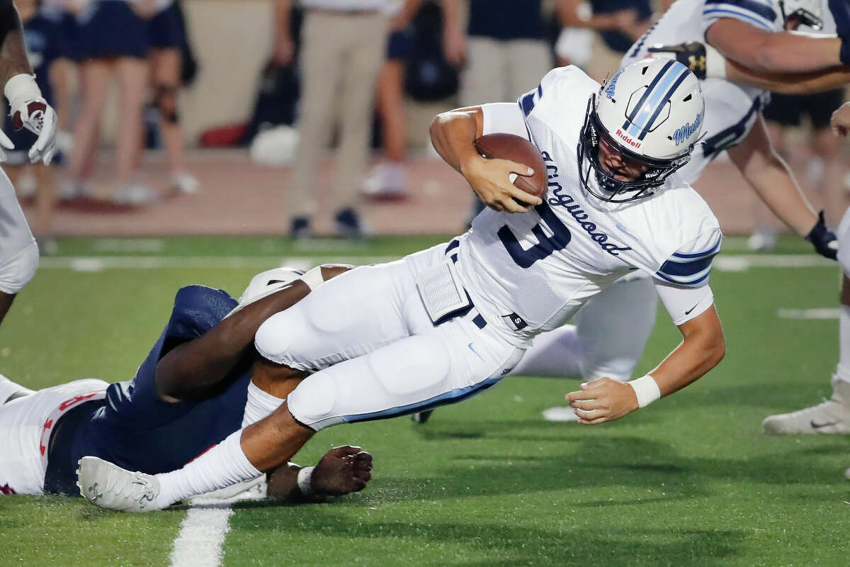 Kingwood quarterback Trey Reese (3) is sacked by Atascocita defensive lineman Pharrell Gordon, left, during the first half of their District 21-6A high school football game Friday, Sept. 23, 2022 in Humble, TX.