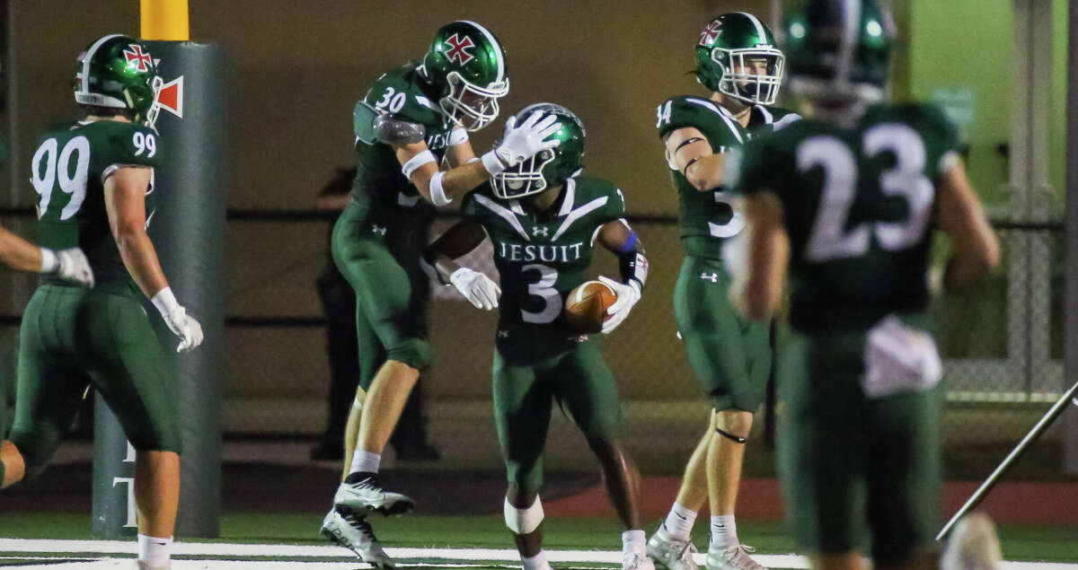 HOUSTON, TX SEP 23: Strake Jesuit Nate Twardowski (30) congratulates Strake Jesuit Bryce Lanier (3) on his touchdown in the first quarter during the District 23-6A high school football game between the Elsik Rams and Strake Jesuit Fighting Crusaders at Clay Stadium in Houston, Texas.