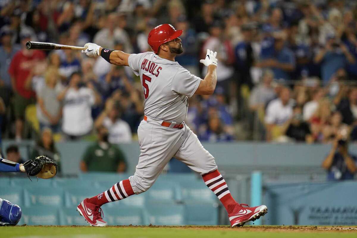St. Louis Cardinals designated hitter Albert Pujols (5) hits a home run during the fourth inning of a baseball game against the Los Angeles Dodgers in Los Angeles, Friday, Sept. 23, 2022. Brendan Donovan and Tommy Edman also scored. It was Pujols' 700th career home run.