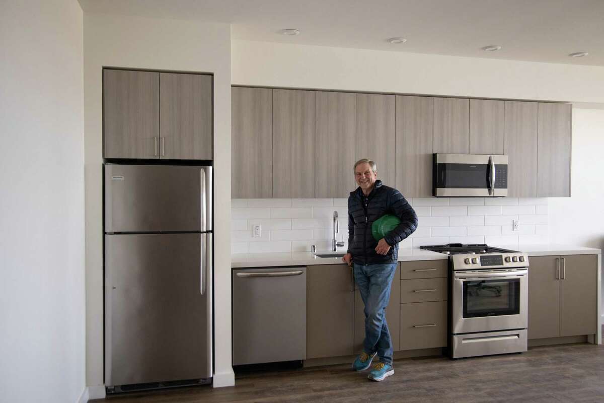 Rick Holliday, CEO of Factory OS stands in a modular apartment that was built indoors and brought to the building site next to El Cerrito del Norte BART station in Oakland, in 2021.