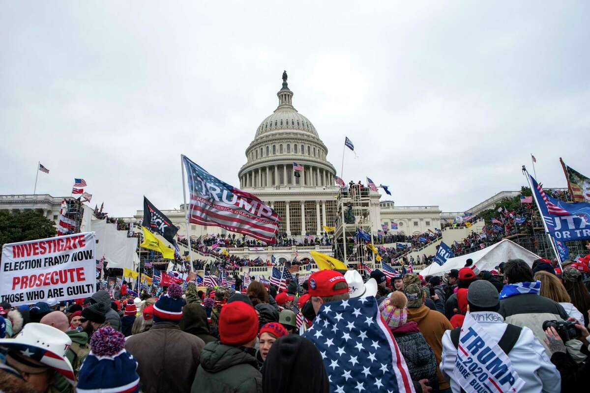 FILE - Rioters loyal to President Donald Trump rally at the U.S. Capitol in Washington on Jan. 6, 2021. The trial of the founder of the Oath Keepers, Stewart Rhodes, and four associates charged with seditious conspiracy in the attack on the U.S. Capitol is set to begin next week.