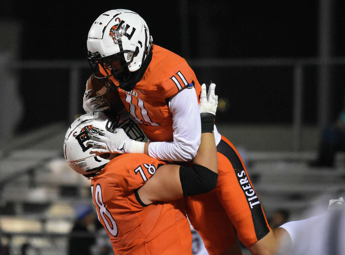 Edwardsville's Joey DeMare is congratulated by Dawson Rull after a touchdown against Belleville West on Friday inside the District 7 Sports Complex in Edwardsville.