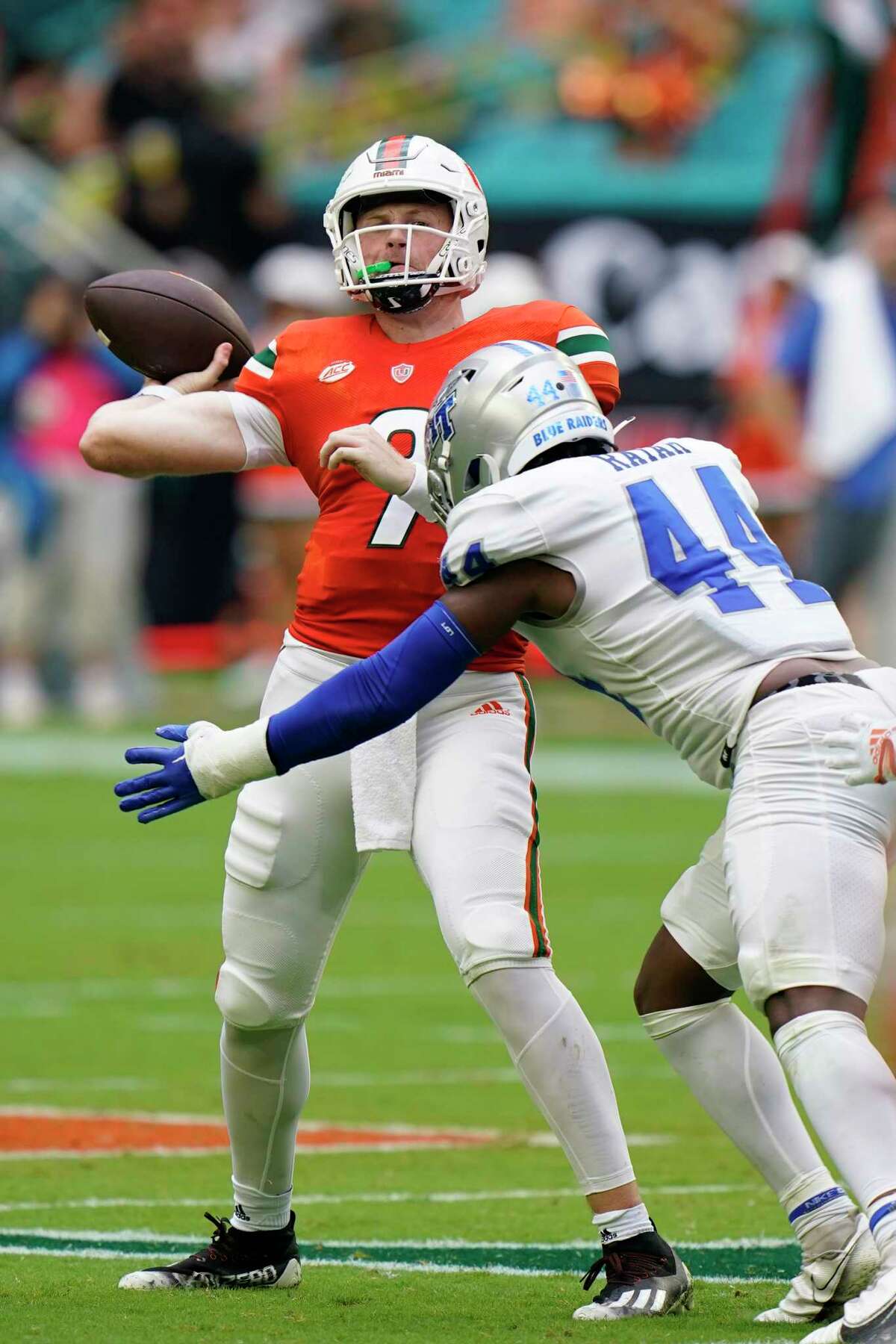 Middle Tennessee linebacker Jalen Rayam (44) rushes Miami quarterback Tyler Van Dyke (9) as he passes during the first half of an NCAA college football game, Saturday, Sept. 24, 2022, in Miami Gardens, Fla.