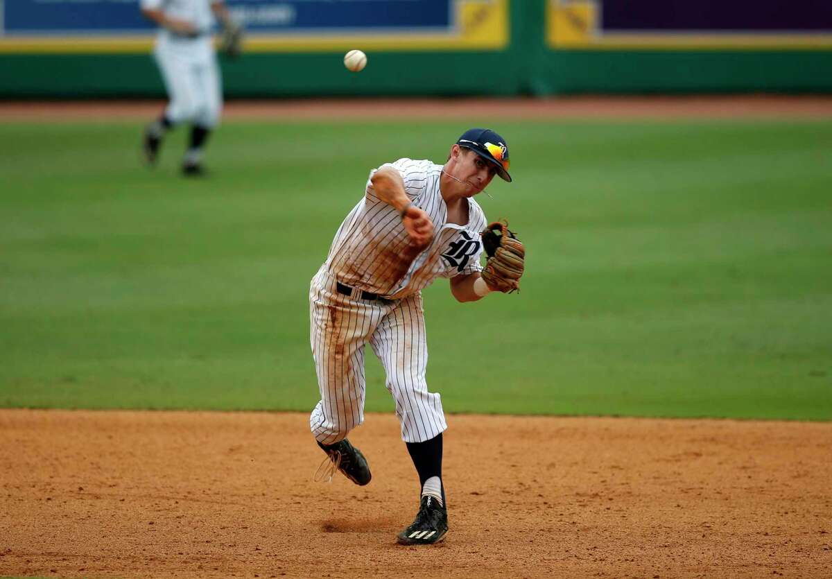 Rice shortstop Ford Proctor (8) throws out Southeastern Louisiana's Jacob Seward in the seventh thinning of an NCAA college baseball tournament regional game in Baton Rouge, La., Sunday, June 4, 2017. Rice won 9-5. (AP Photo/Gerald Herbert)