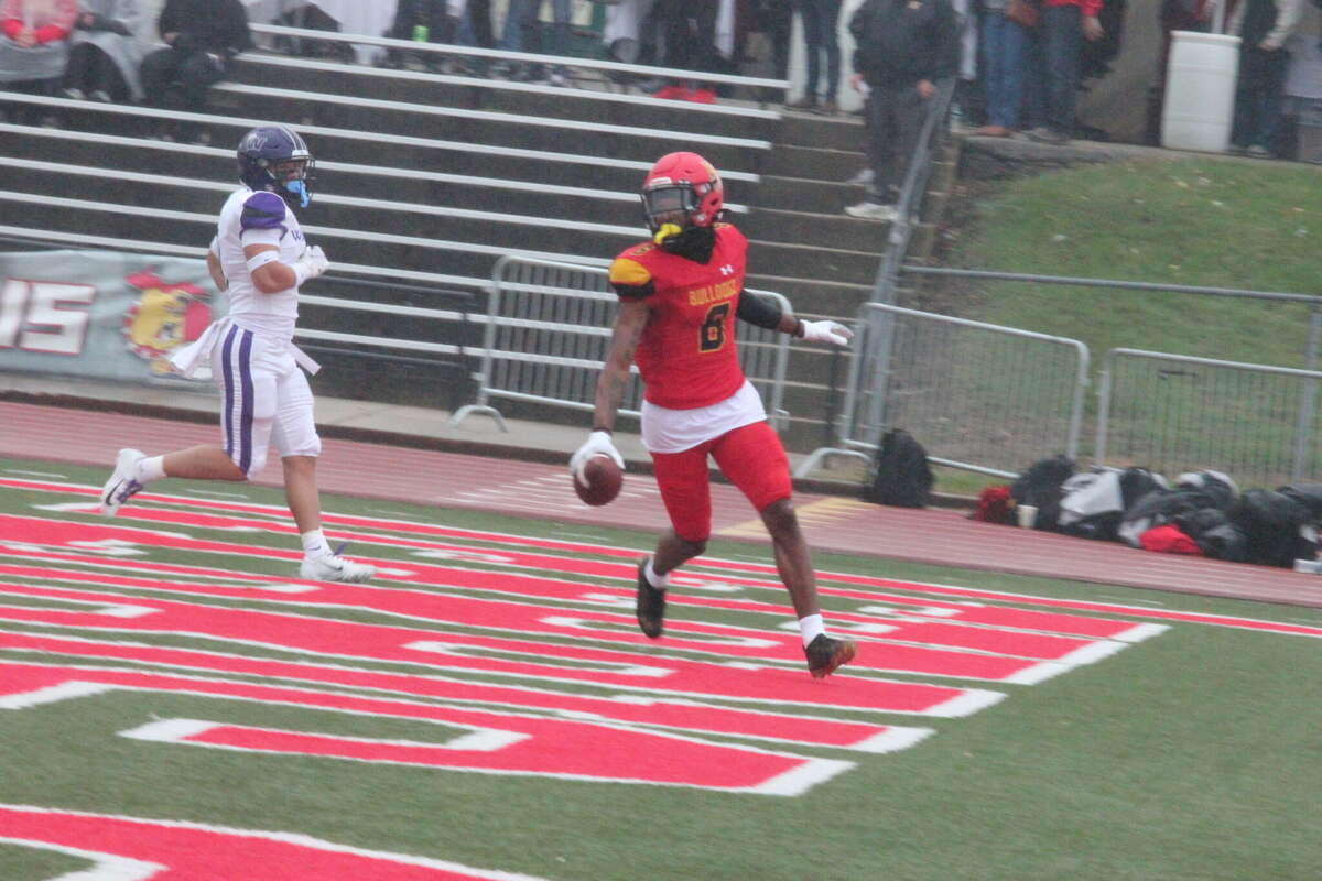Ferris' Tyrese Hunt-Thompson winds up in the end zone after a 63-yard touchdown pass from Evan Cummins to open the scoring on Saturday.