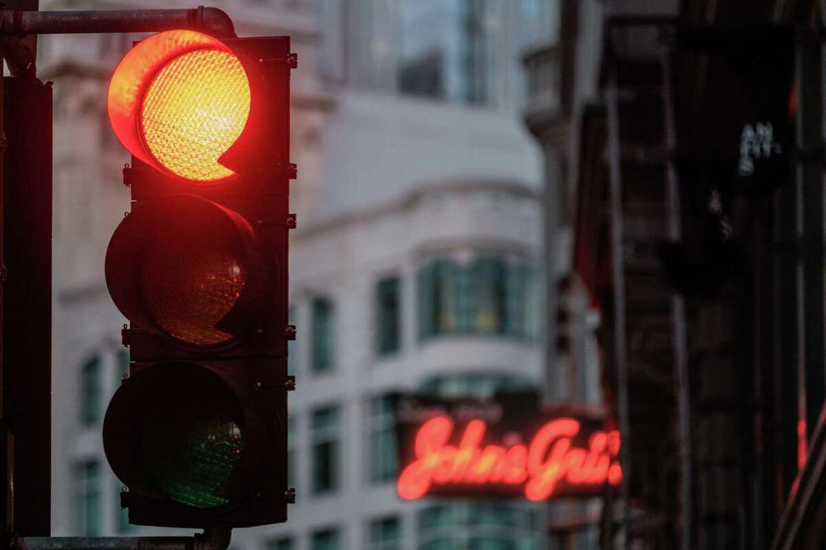 A traffic light is seen in downtown San Francisco on Friday, June 4, 2021. Stop lights were flashing red across the city on Saturday.