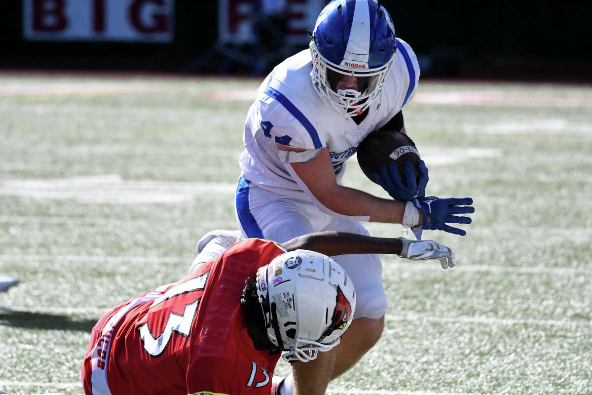 Southington's Lincoln Cardillo breaks a tackle during a football game between Southington and Greenwich at Cardinal Stadium, Greenwich on Saturday, Sept. 24, 2022.