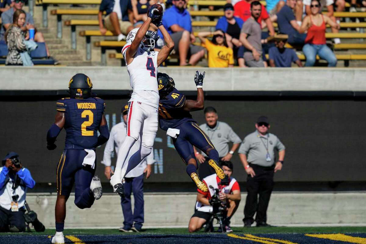 Arizona wide receiver Tetairoa McMillan (4) catches a 24-yard touchdown over California cornerback Isaiah Young (41) during the first half of an NCAA college football game in Berkeley, Calif., Saturday, Sept. 24, 2022. (AP Photo/Godofredo A. Vásquez)