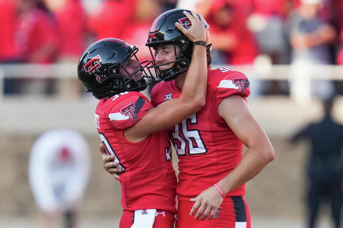 Texas Tech's Trey Wolff (36) and Jackson Knotts (30) following a a field goal kick from Wolff in the fourth quarter against the Texas Longhorns at Jones AT&T Stadium on September 24, 2022 in Lubbock, Texas. 