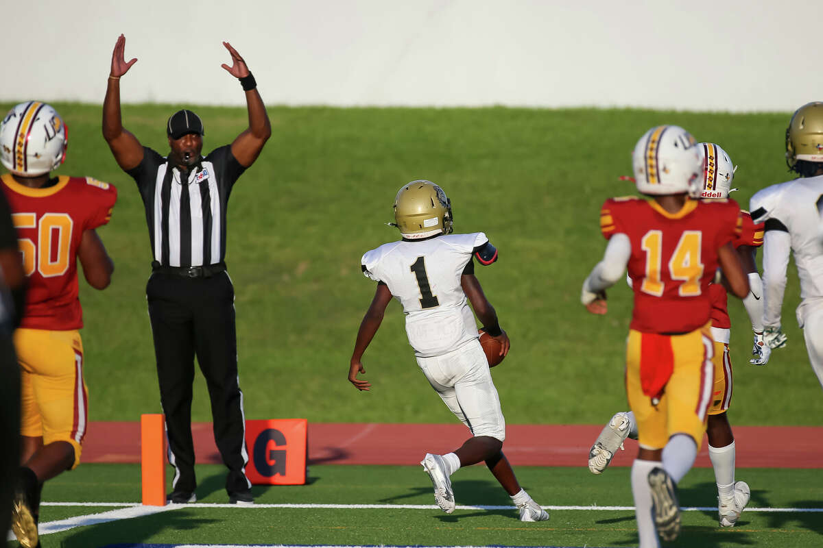 HOUSTON, TX SEP 24: North Forest Clinton Babineaux (1) scores a touchdown in the first quarter during the District 11-4A Division I high school football game between the North Forest Bulldogs and Yates Lions at Barnett Stadium in Houston, Texas.