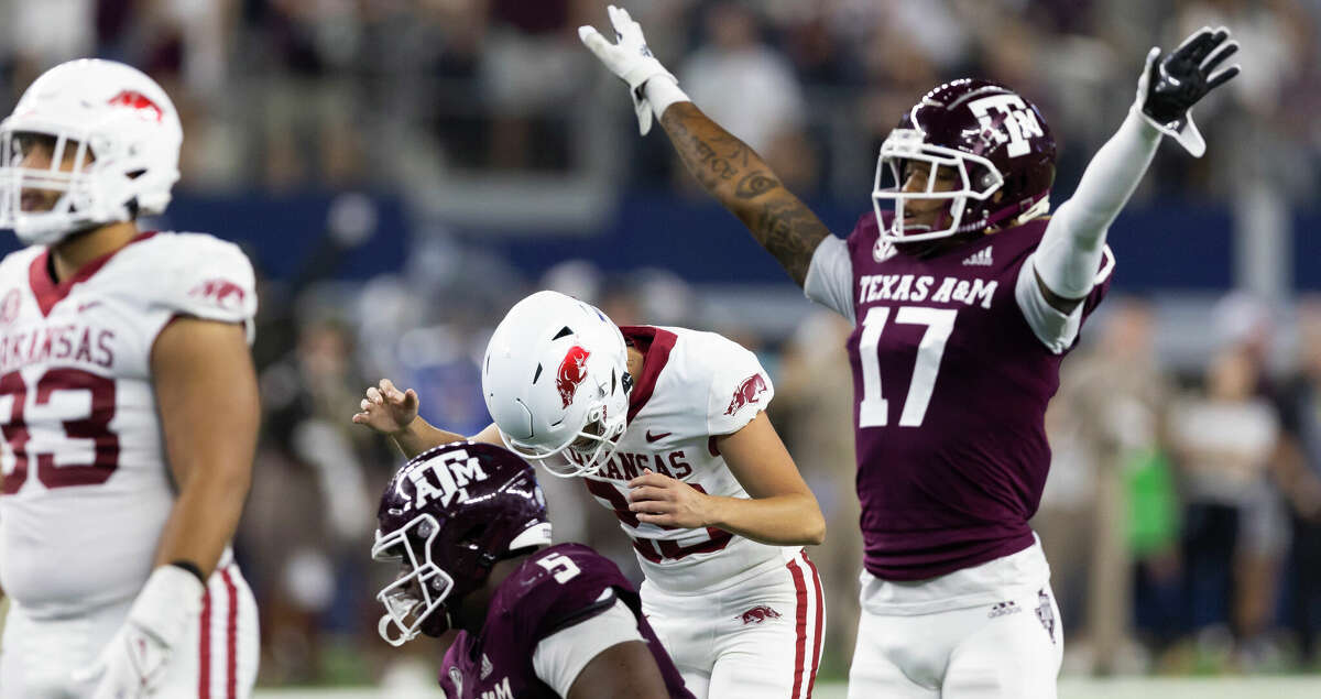 Arkansas place-kicker Cam Little (29) reacts after missing a field goal in the closing minutes of the team's NCAA college football game against Texas A&M on Saturday, Sept. 24, 2022, in Arlington, Texas. Texas A&M won 23-21. (AP Photo/Brandon Wade)