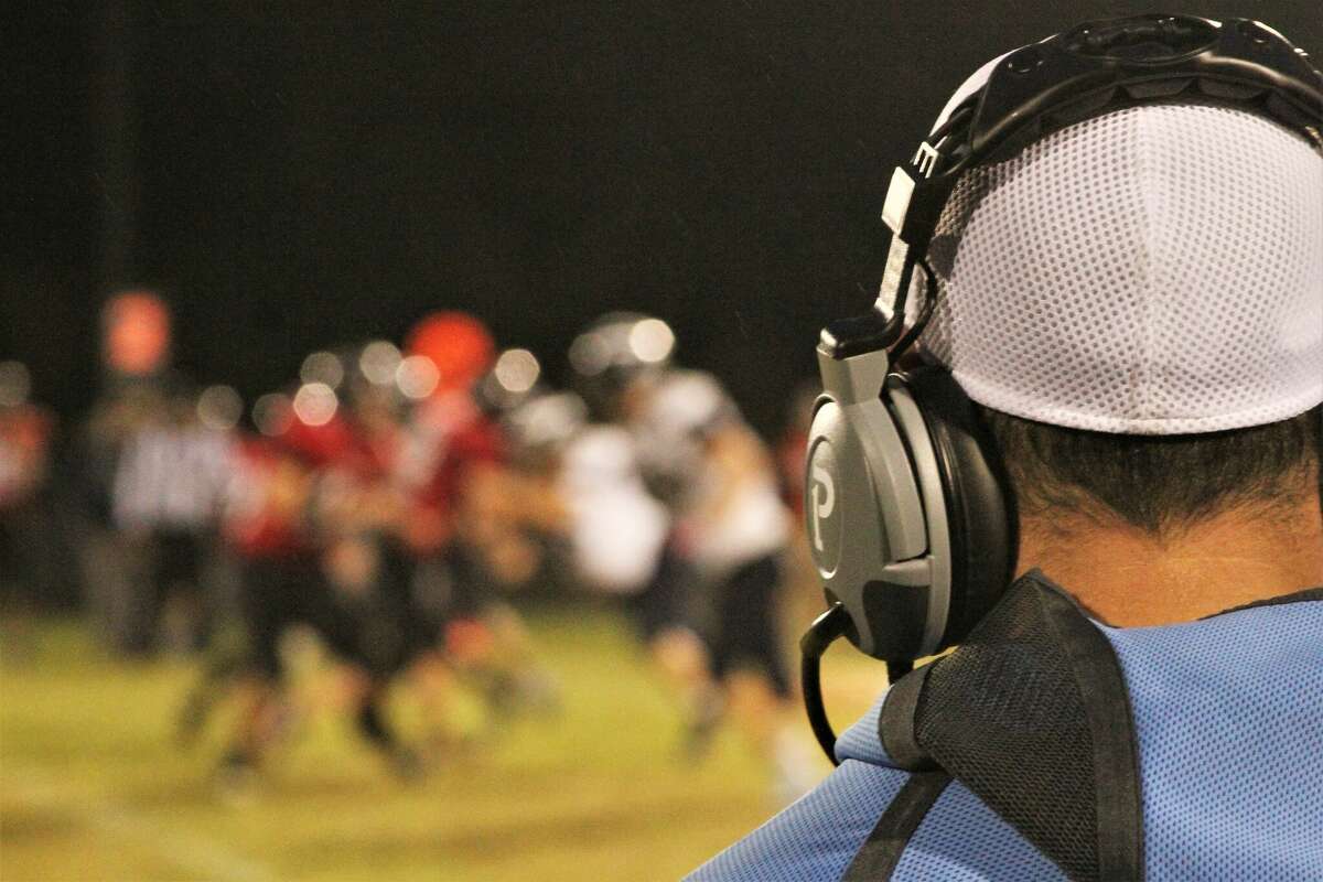 Brethren coach JJ Randall watches a play unfold on Sept. 24 at Brethren High School. The Bobcats defeated the Lakers 42-14. 