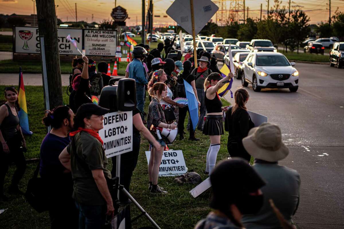 Members of the LGBTQIA+ community and ANTIFA gather outside of First Christian Church to show their support while a “Drag Bingo” event was being held inside the church, on Saturday, September 24, 2022 in Katy, TX. Over 100 protesters, including Proud Boys, Aryan Freedom Network and various church groups, were protesting against the event, from the opposite side of the street.