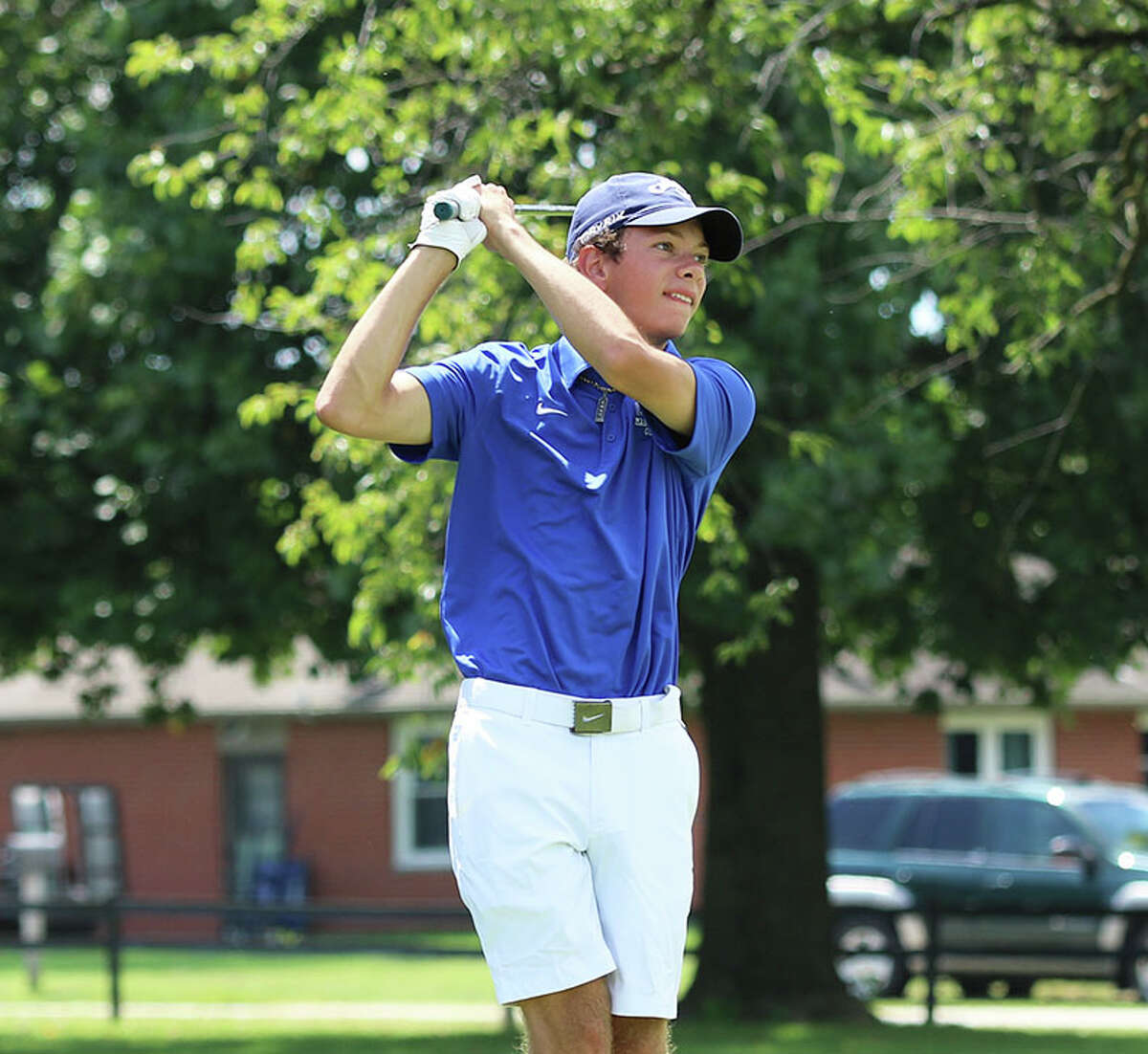 Marquette Catholic's Will Schwartz watches his shot earlier this season in the Madison County Tourney at Belk Park in Wood River. On Friday, Schwartz shot 79 at Belk to finish second in the inaugural Gateway Metro Conference Tournament.
