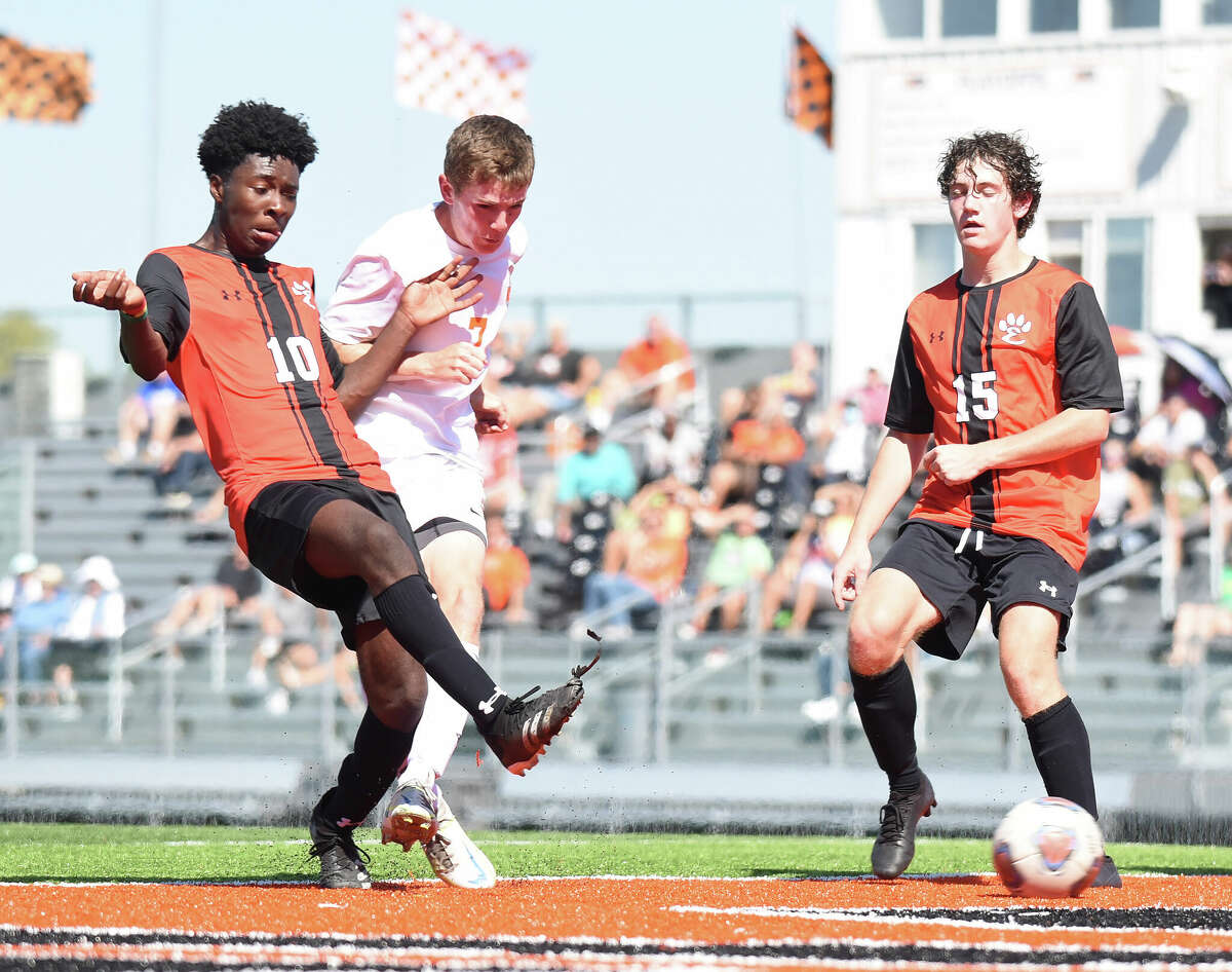 Edwardsville's Axton Anom puts a shot on goal against Normal Community during the second half on Saturday inside the District 7 Sports Complex in Edwardsville.