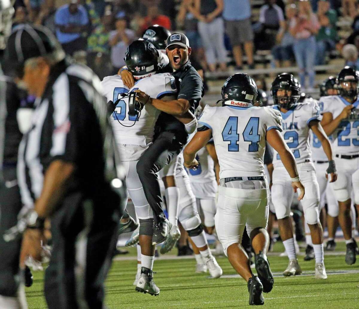 Harlan celebrates after Warren fumbled the ball in OT on Saturday, Sept. 24, 2020 at Gustafson Stadium Holmes defeated Warren 59-52 in OT.