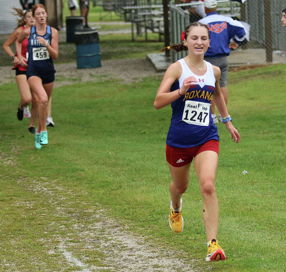 Roxana senior Gabrielle Woodruff (right) pushes for the finish at the Granite City Invite on Sept. 3 in Granite. Woodruff posted a PR while placing 12th at the Freeburg Invite on Saturday in Smithton.