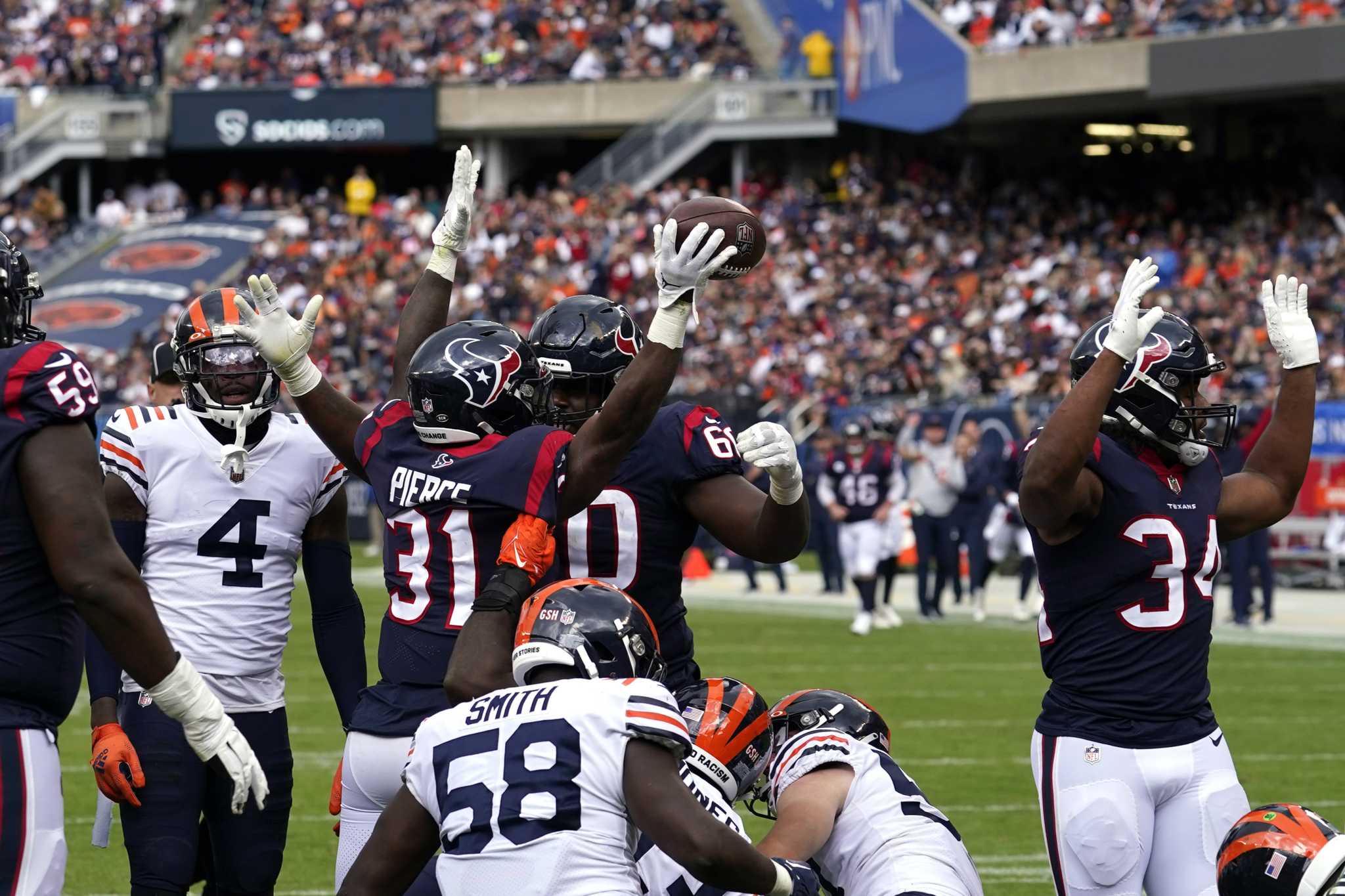 Chicago Bears tight end Cole Kmet is tackled by Houston Texans safety  Jonathan Owens during the second half of an NFL football game Sunday, Sept.  25, 2022, in Chicago. The Bears won