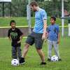 Capital District YMCA soccer team coach Jeremy Eberhardt instructs Sah Teh Aye and Farkhan prior to a game at Bleeker Stadium in Albany, NY, on Sunday, Sept. 18, 2022. (Jim Franco/Special to the Times Union)