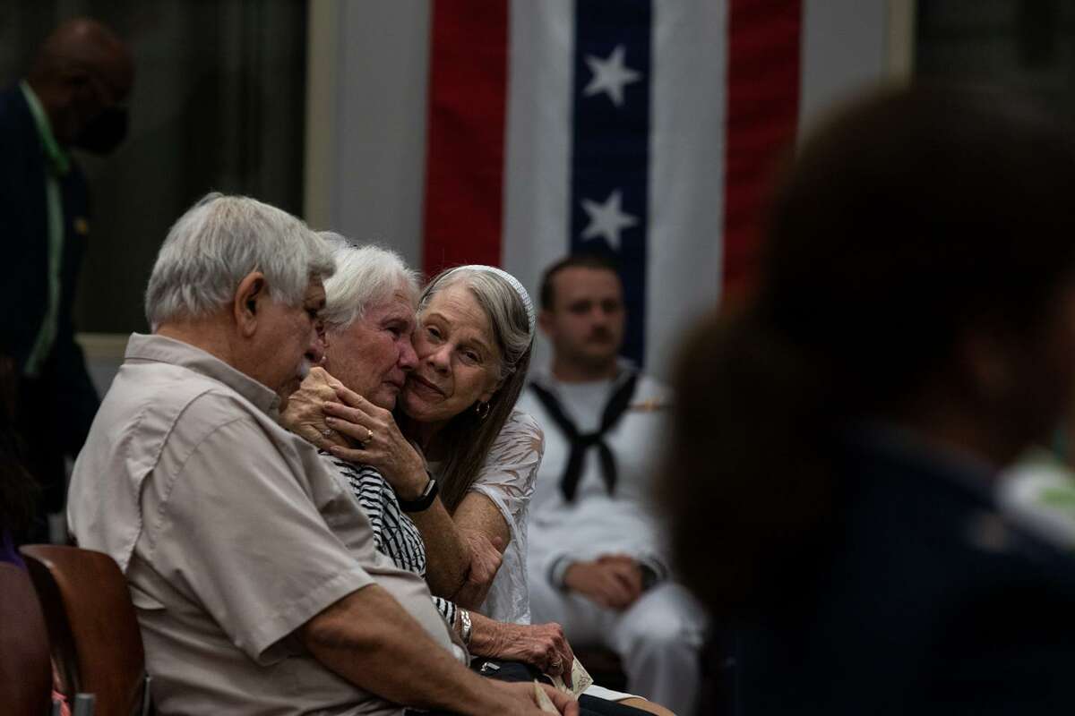 Mary Rose Johnson (right) comforts Rhonda Canales (middle) and her husband, Paul Canales, at a ceremony for Gold Star Mothers and Families at Joint Base San Antonio-Fort Sam Houston on Sunday. (Kaylee Greenlee Beal/Contributor)