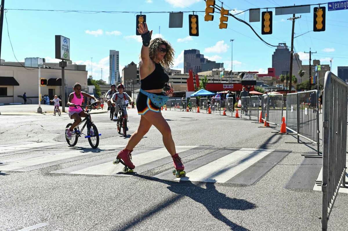 Shannon Churchwell roller skates into an intersection Sunday during Síclovía. The free event primarily draws cyclists but anyone can wheel themselves along.