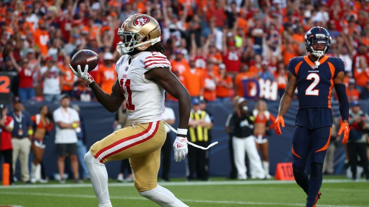 DENVER, COLORADO - SEPTEMBER 25: Brandon Aiyuk #11 of the San Francisco 49ers celebrates after scoring a touchdown during the first half against the Denver Broncos at Empower Field At Mile High on September 25, 2022 in Denver, Colorado. (Photo by Jamie Schwaberow/Getty Images)