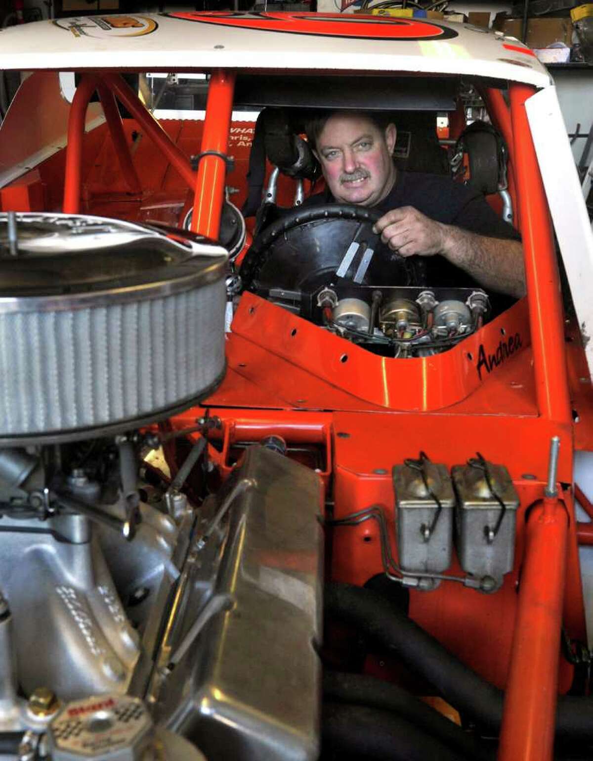 Race car driver now coowns repair shop