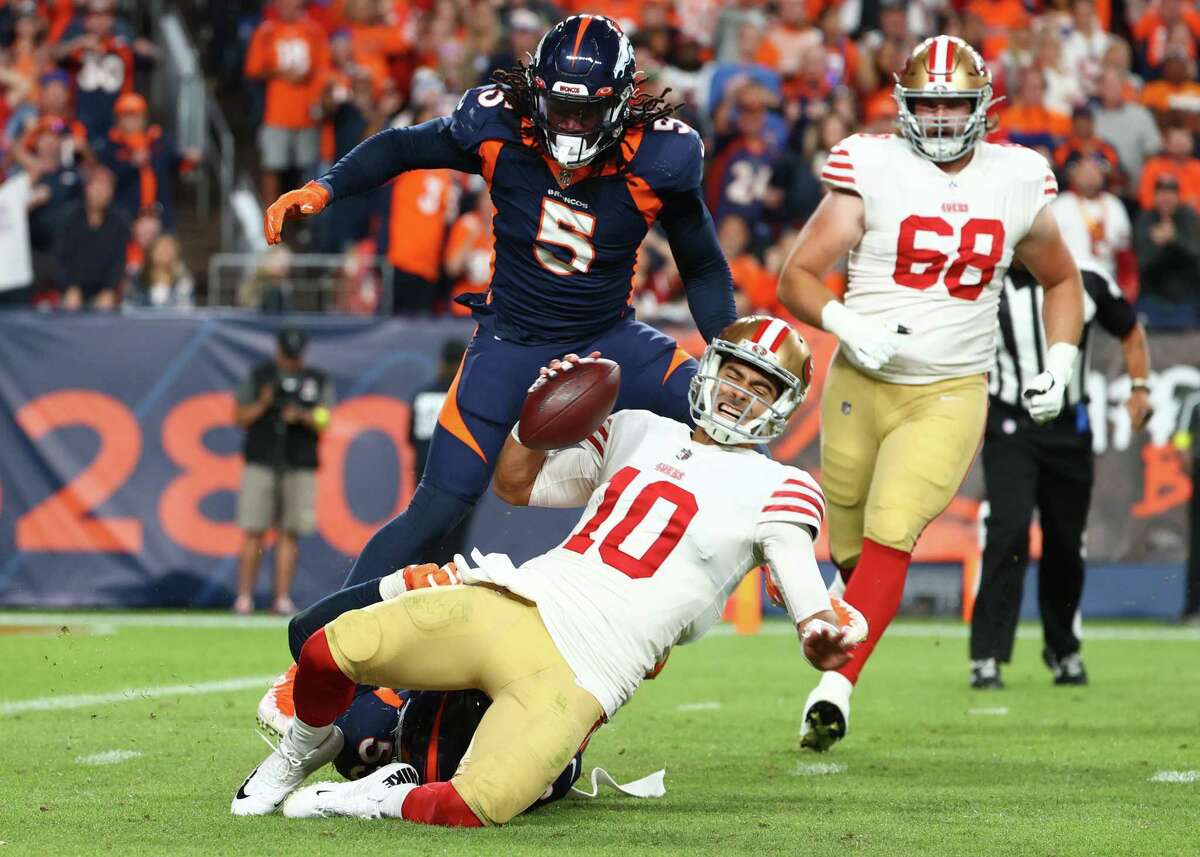 DENVER, COLORADO - SEPTEMBER 25: Bradley Chubb #55 of the Denver Broncos sacks Jimmy Garoppolo #10 of the San Francisco 49ers during the fourth quarter of a game at Empower Field At Mile High on September 25, 2022 in Denver, Colorado. (Photo by Jamie Schwaberow/Getty Images)
