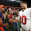 DENVER, COLORADO - SEPTEMBER 25: Russell Wilson #3 of the Denver Broncos and Jimmy Garoppolo #10 of the San Francisco 49ers talk after their game at Empower Field At Mile High on September 25, 2022 in Denver, Colorado. (Photo by Jamie Schwaberow/Getty Images)