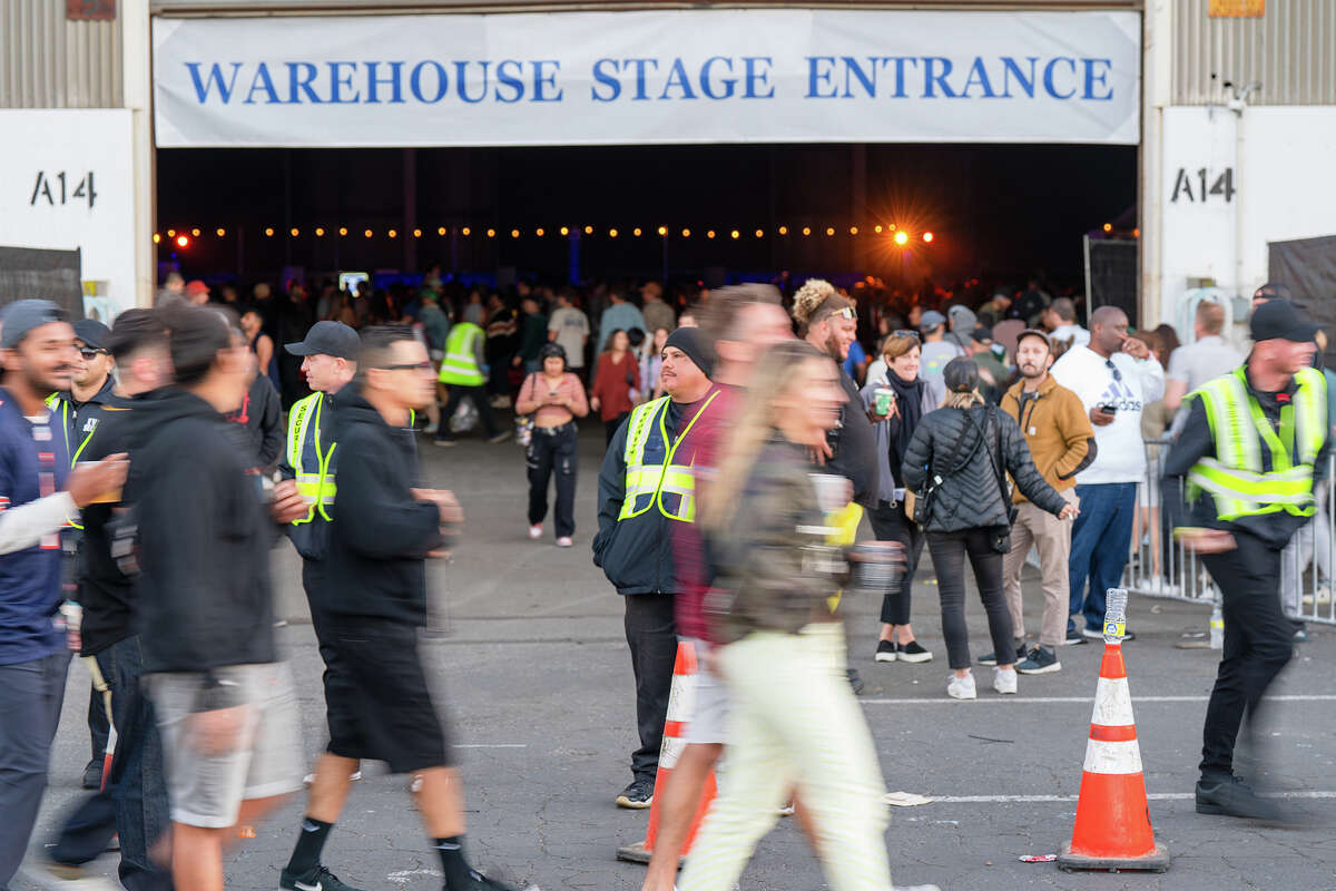 Security guards stand near the entrance of the Warehouse Stage at the Portola music festival in San Francisco on Sunday.