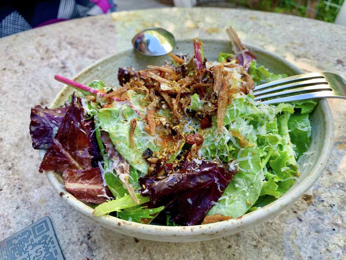 Baby greens with bagna cauda and tiny fried fish at Roots Wine Bar