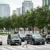A man crosses Post Oak Boulevard on Friday, Aug. 26, 2022, in Houston.