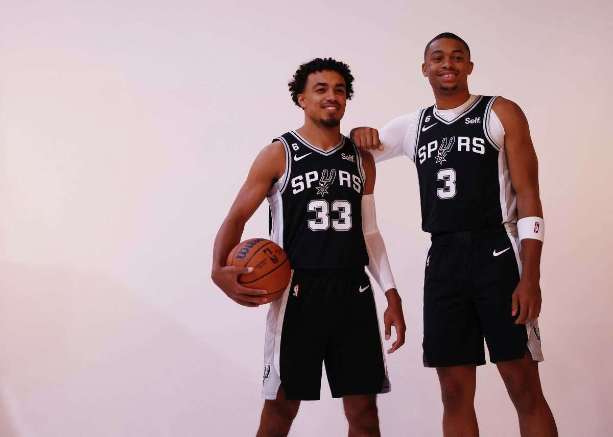 Spurs’ Keldon Johnson (03) and Tre Jones (33) pose together for a photo as the team holds their 2022-23 Media Day at their practice facility on Monday, Sept. 26, 2022.